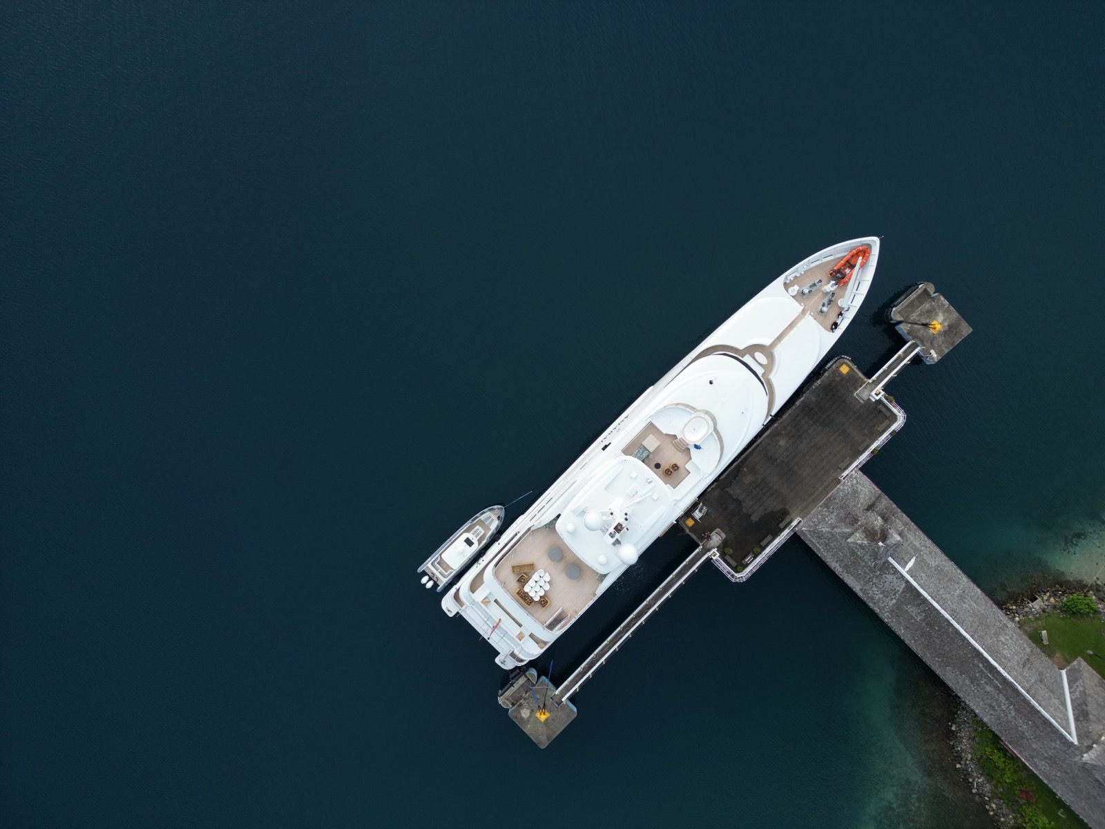 Aerial view of a mega-yacht moored at the Errol Flynn Marina dock