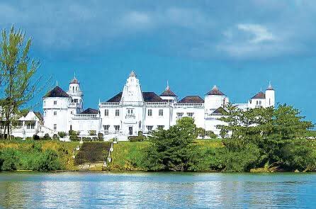 The white turreted Trident Castle rising above the water near Port Antonio