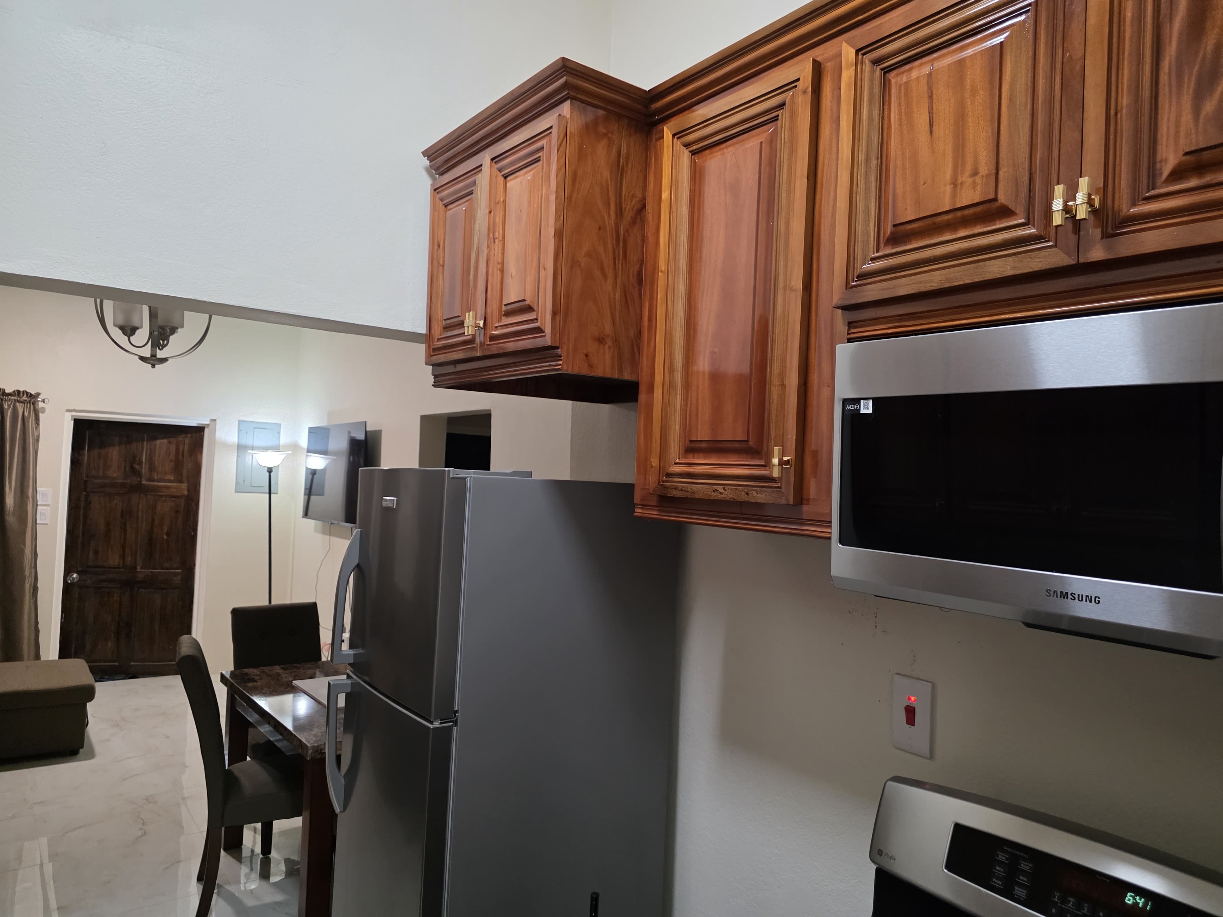 Kitchen with wood cabinetry and stainless appliances