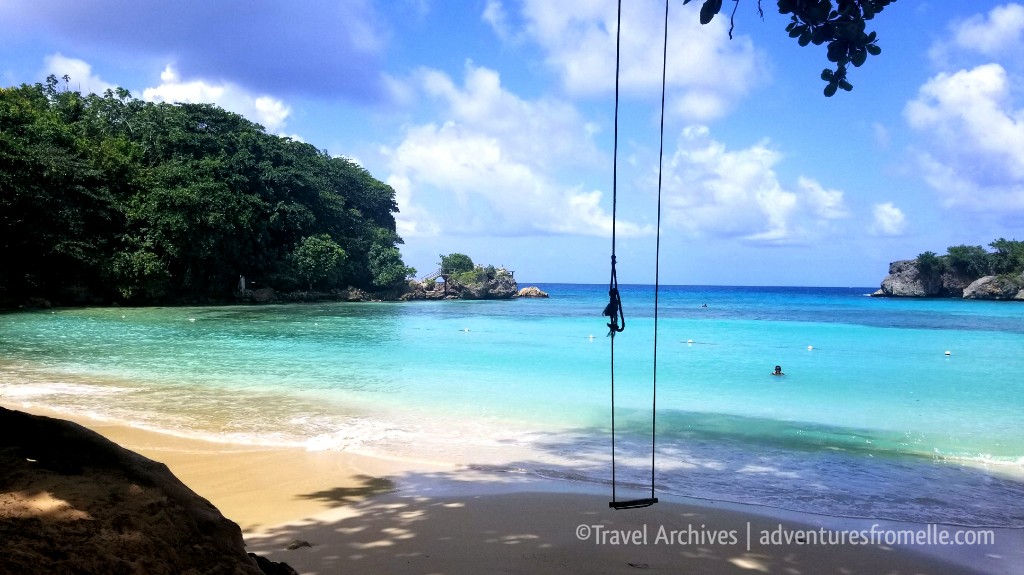 Boston Beach turquoise cove with a rope swing under tree shade (placeholder image — to be replaced)
