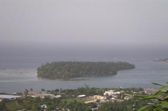A wooded island sitting in Port Antonio harbor with the town in the foreground (placeholder image — to be replaced)